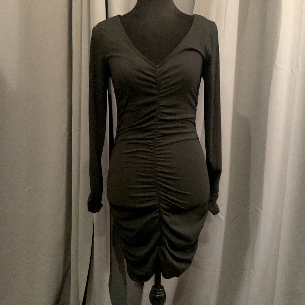 Super sexy little black dress with ruching on front, back and bottom of sleeves